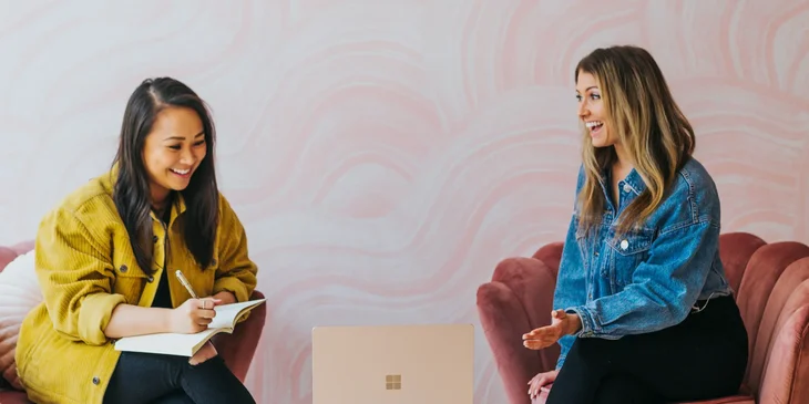 Two women engaged in a lively discussion.