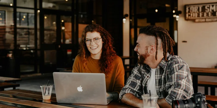 A man and a woman engaged in a lively conversation.
