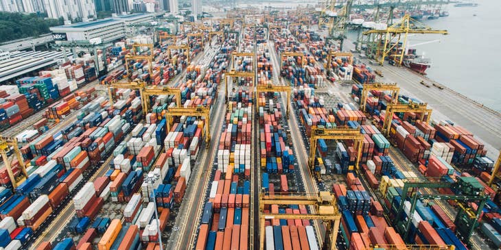 Shipping yard filled with shipping containers for logistics purposes.