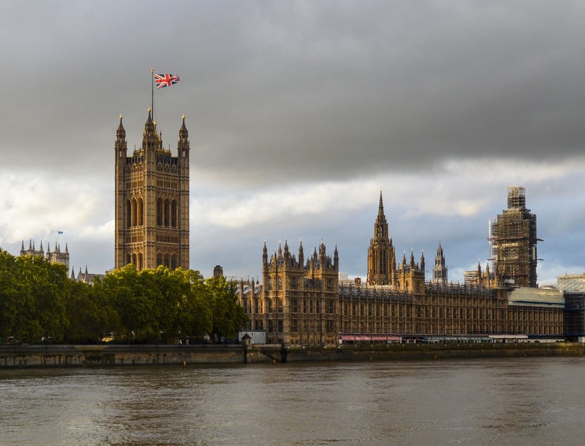 The Palace of Westminster in front of the Thames in London.