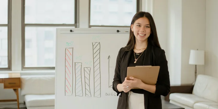 A woman giving a presentation at work.