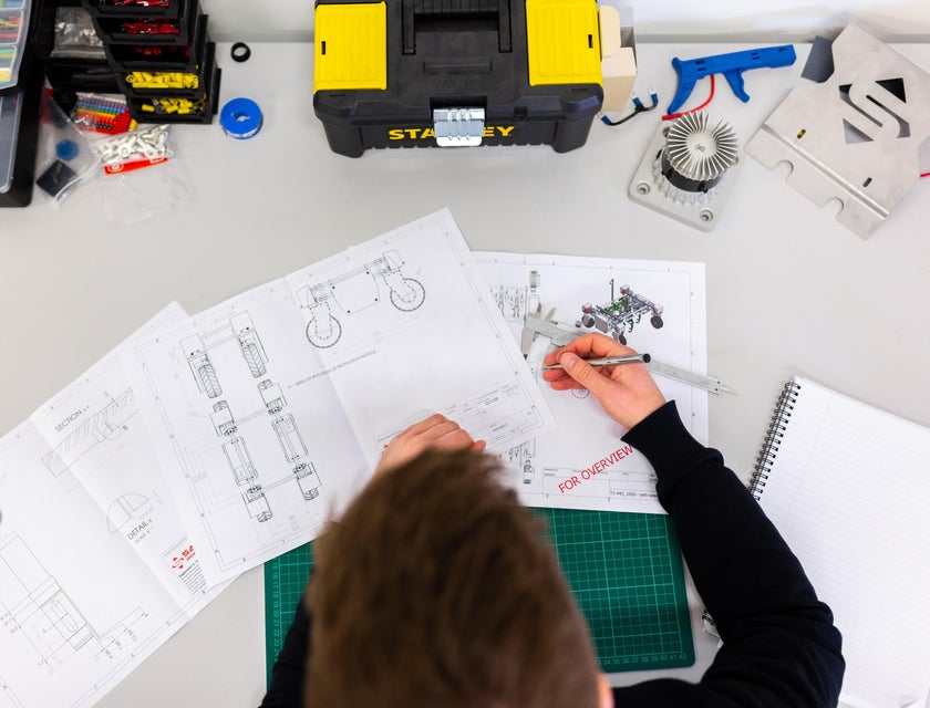 a mechanical design engineer reviewing design plans