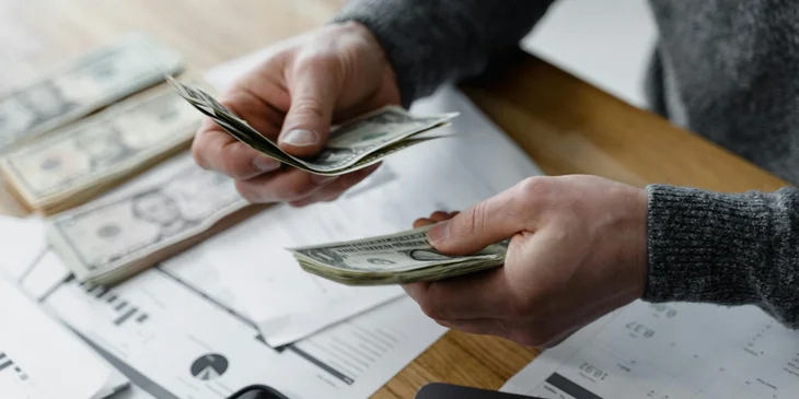 A medical biller processing a payment received from a client.