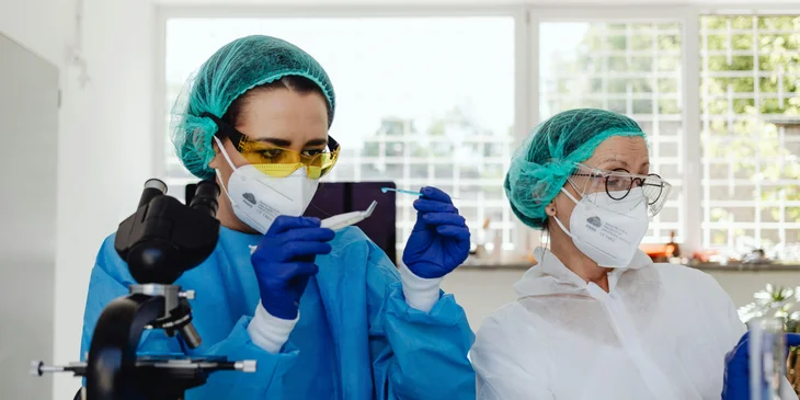 Medical technologists analyzing the samples.