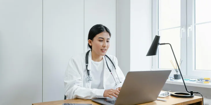 A medical doctor conducting an online consultation with a patient.