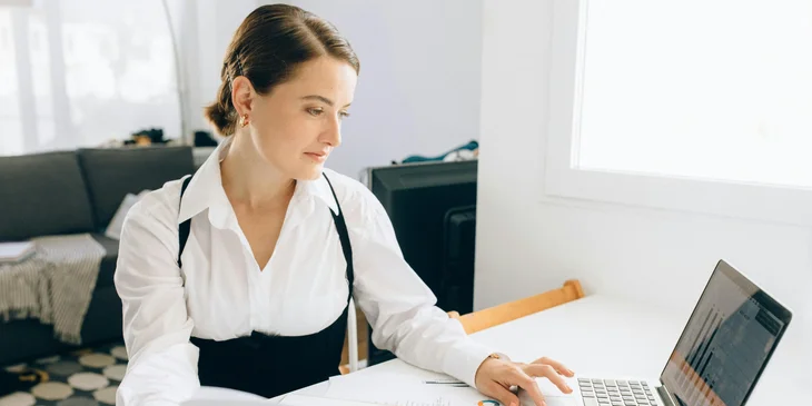 A medical representative working at her desk.
