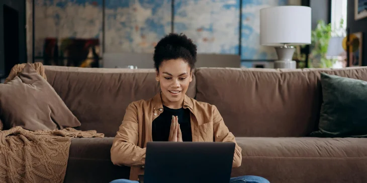 A person working on their laptop.