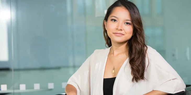 A woman wearing a white shirt.