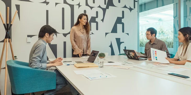 Team members holding a meeting in the office.