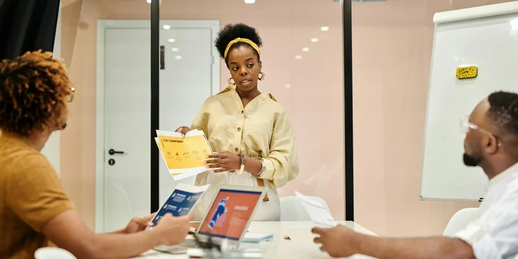 A woman sharing her ideas during the meeting.