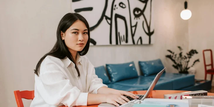 An animation professional working diligently on her computer.