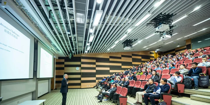 A motivational speaker discusses inspiring topics with college students.
