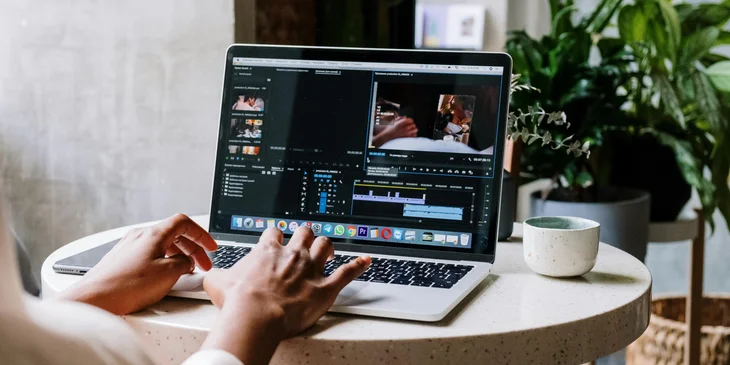 A multimedia designer editing content for her client's new project.