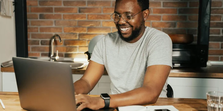 A man using a laptop.