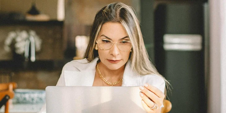 A woman working at a table.