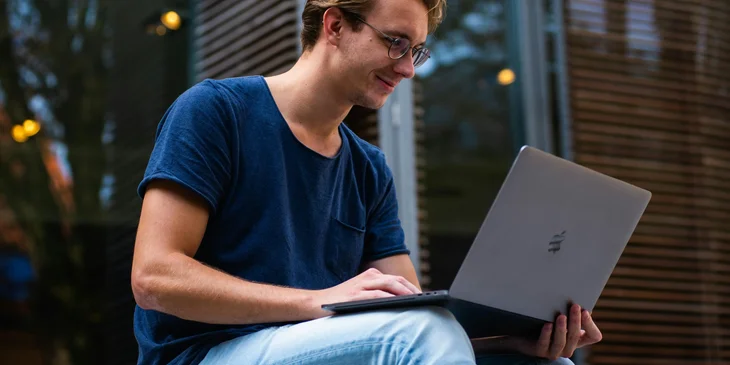 A man using a laptop.