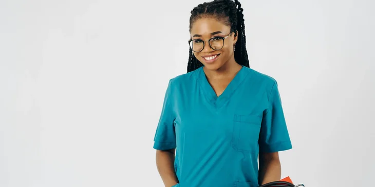 A nurse wearing a scrub suit.
