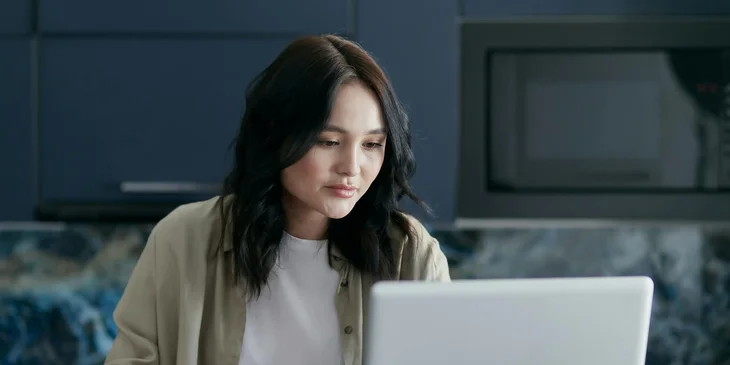 An office assistant working at her desk.