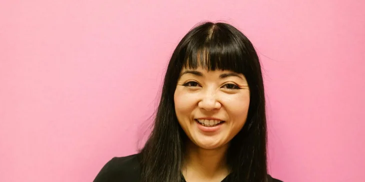 A woman smiling at the camera.