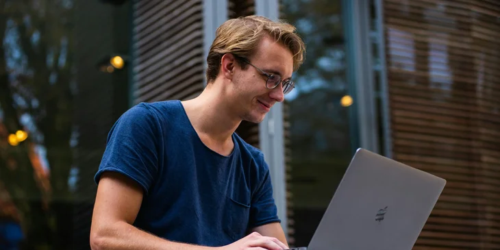 A man using his laptop.