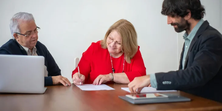 A woman signing a paid time off policy.