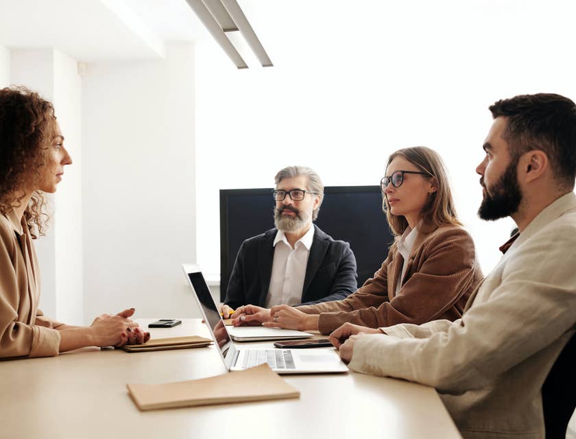 A group of interviewers conducting a panel interview with a prospective candidate.