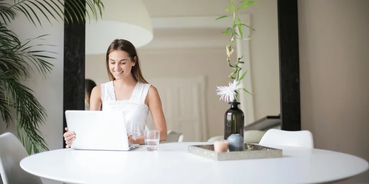 A woman working remotely from home.