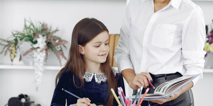 paraprofessional working with a student