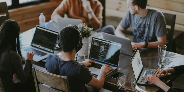 Workers busy working at their desks.