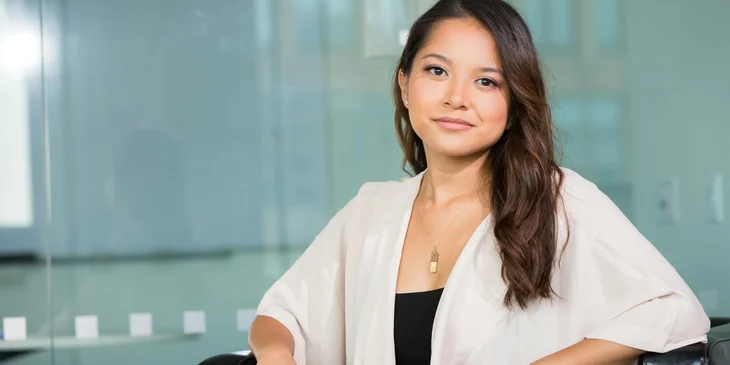 A woman wearing a white shirt.