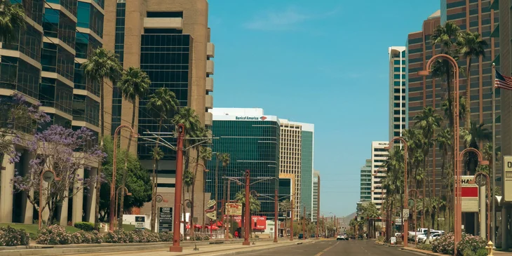 A street lined with tall buildings in Phoenix, Arizona.