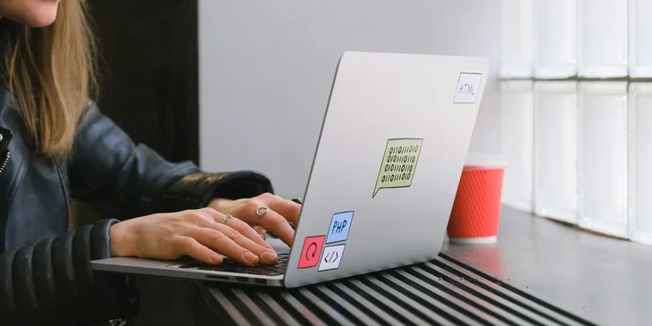 A PHP developer working on her laptop.