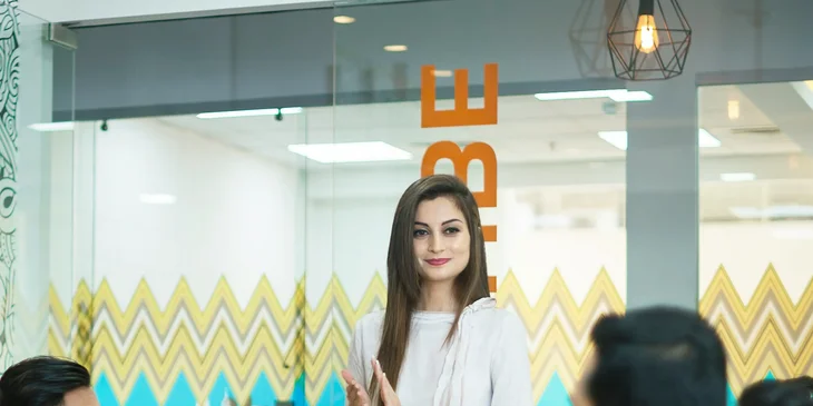 An employee giving a presentation at work.