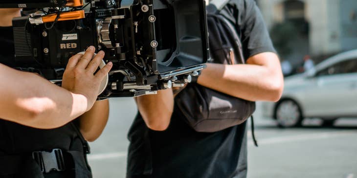 production assistant helping the director