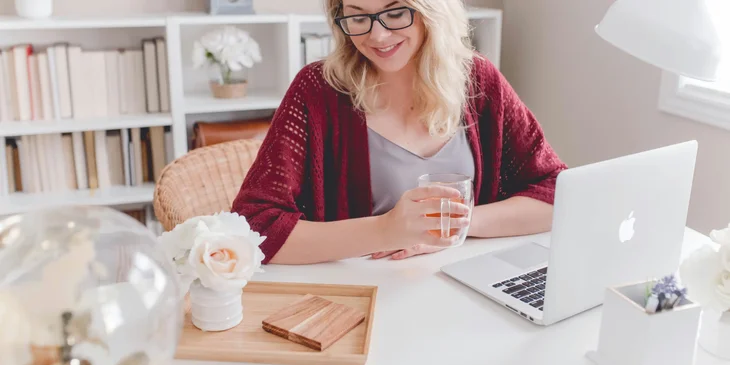 A woman working at her desk.