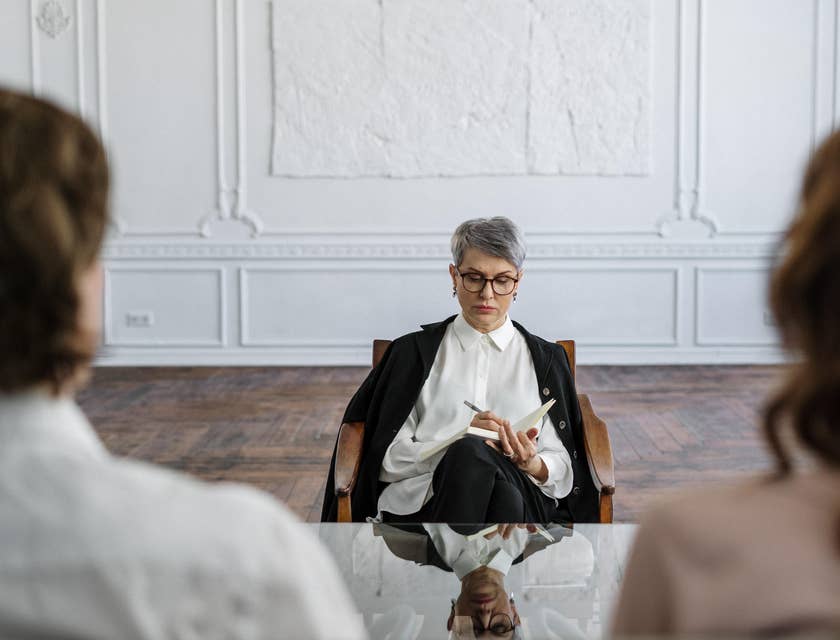 Psychologist making notes in a session