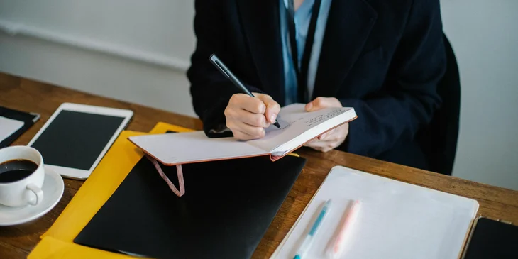 A purchasing manager preparing an estimate for the cost of the upcoming procurement to replenish inventory stocks.