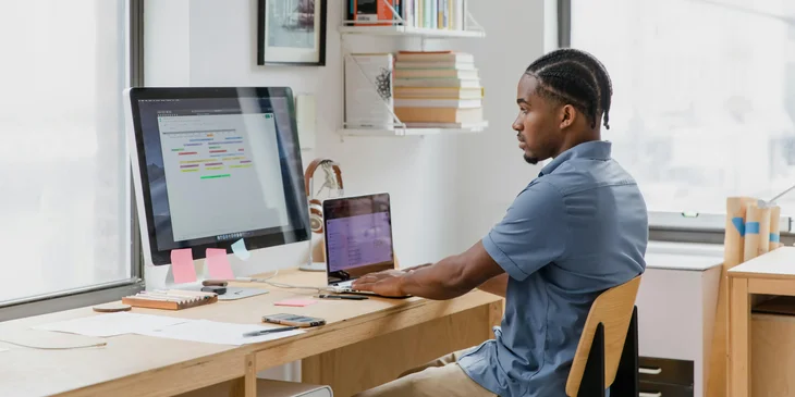 An intern working at his workstation.