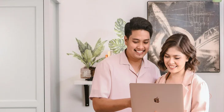 A woman and a man with a laptop.