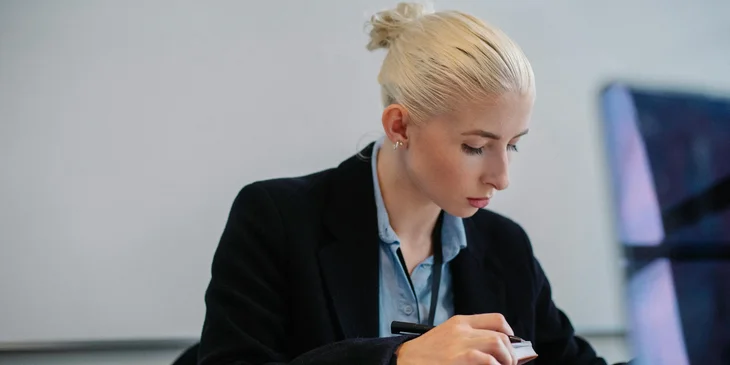 A regional sales manager reviewing the sales report before submitting it.