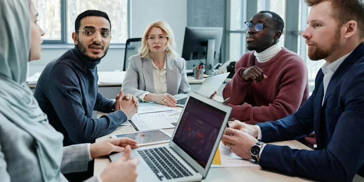 Regulatory compliance specialists having a meeting.