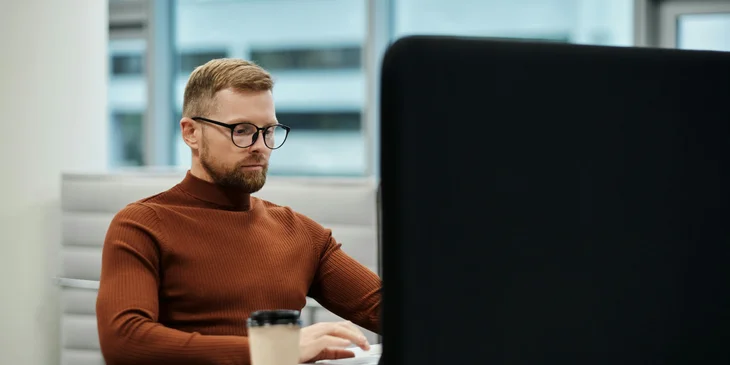 A man working on his laptop.