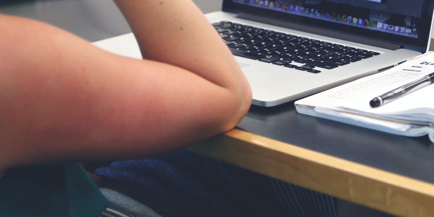 A woman writing <a href=