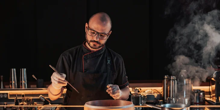 A chef preparing a meal.