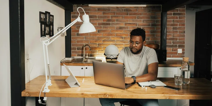 A man working on his laptop.
