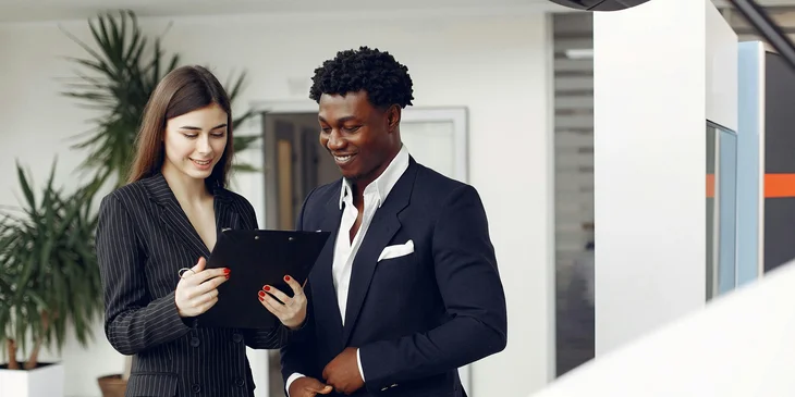 A sales account manager sharing insights and tips with a representative.