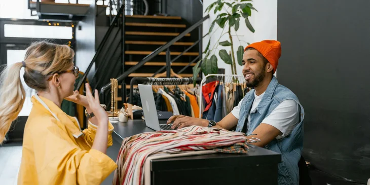 A sales associate attending to a customer.