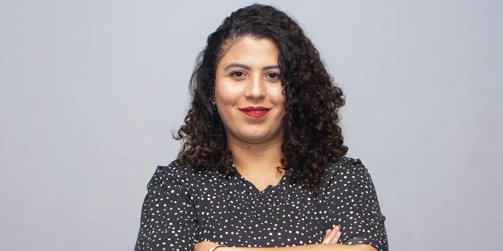 A woman in black and white polka dot dress.