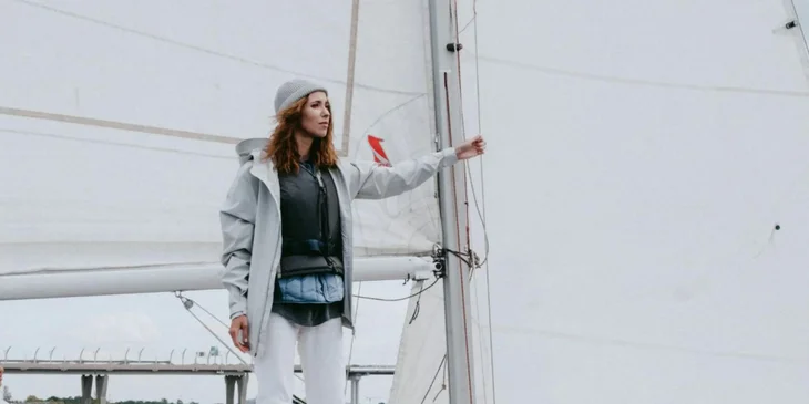 A maritime professional working on a sailboat.
