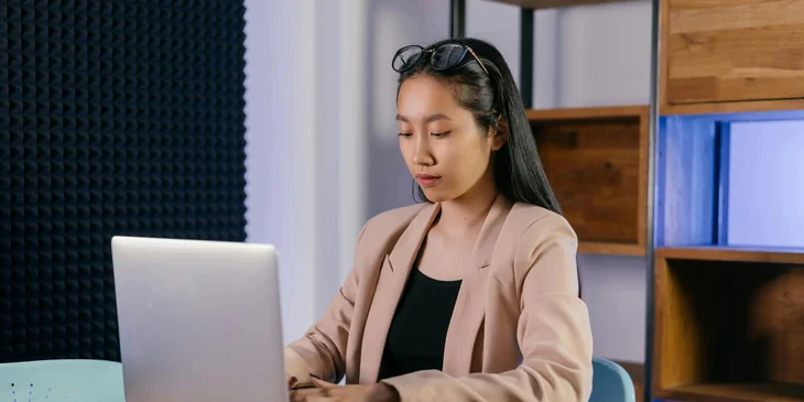 A senior administrative assistant working at her desk.